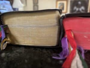 The two daily missals stacked to compare size and thickness