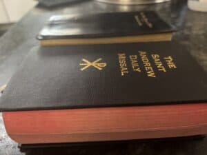 The New Roman Missal and the Saint Andrew Daily Missal side by side, showing the difference in thickness